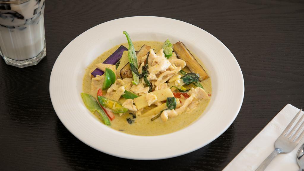 Thai Green Curry · Spicy. Choice of chicken or beef with Thai eggplant, peppers, bamboo shoots, basil and lime leaves in a spicy coconut curry broth.