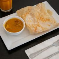 Roti Canai · Spicy. It's the all-time favorite Malaysian crispy Indian style pancake. Served with curry c...