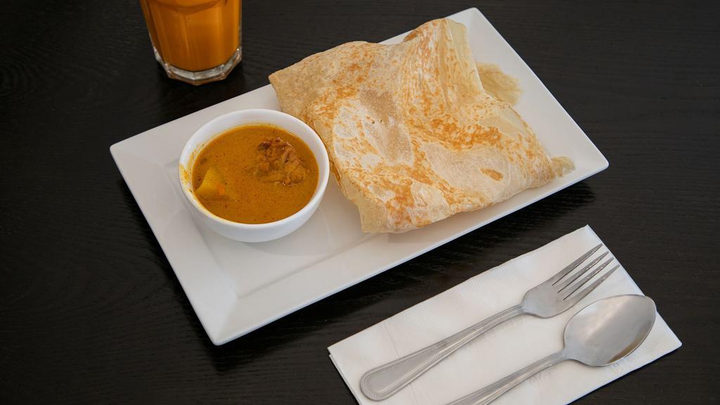 Roti Canai · Spicy. It's the all-time favorite Malaysian crispy Indian style pancake. Served with curry chicken as dipping sauce.