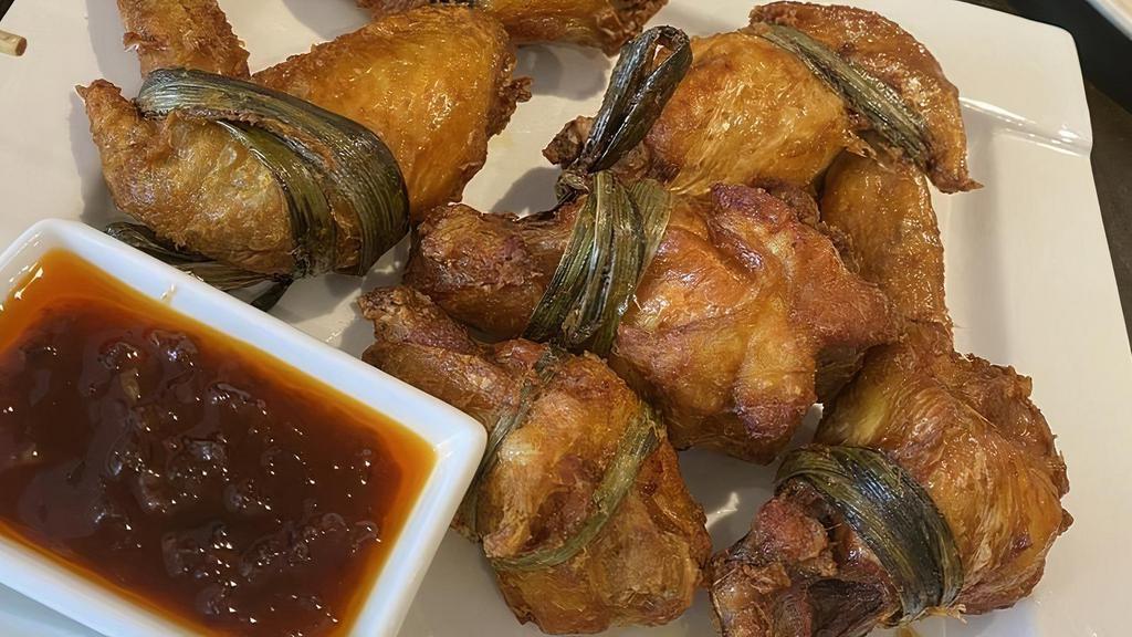 Ayam Pandan · Deep fried chicken wings wrapped in screw pine leaves.