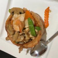 Sarang Burong · Shaped fried taro stuffed with shrimp, chicken, corn, snow peas and black mushroom topped wi...
