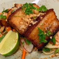 Crispy Pork Belly · Green papaya salad, chili gastrique, mac nuts, red onion, thai herbs.