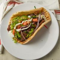 Chicken Gyro · Chicken wrapped on a pita bread, with, tomatoes, onions, cucumber, lettuce, parsley and whit...