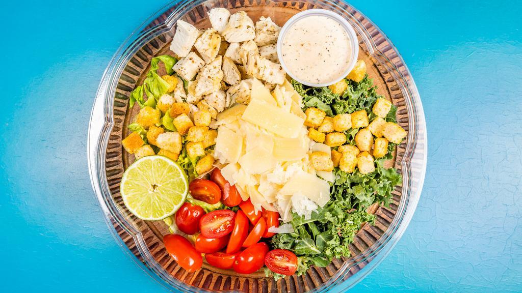 Kale Caesar · Shaved kale, romaine, boiled chicken, cherry tomatoes, shaved parmesan, croutons, lime.