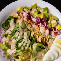 Chopped Salad · baby tomatoes, red onion, romaine, young greens, egg, avocado, radicchio, aged cheddar, crea...
