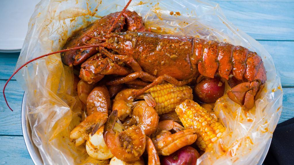 Whole Lobster Combo · 1 .25 lb of whole Maine lobster with choice of 1 lb of Crawfish, Green Mussels, Black Mussels, Clams OR Shrimp.