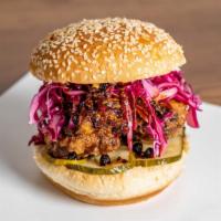 Spicy Fried Chicken Sandwich · Chili Crisp, Cabbage Slaw, Pickles, Sambal Aioli on a Seeded Potato Roll