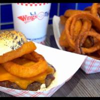 Bbq Burger · One of our 8 oz. burgers with BBQ sauce, cheddar cheese and onion rings.
