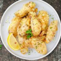 Garlic Parmesan Proper Wings · Fresh chicken wings breaded, fried until golden brown, and tossed in garlic and parmesan. Se...