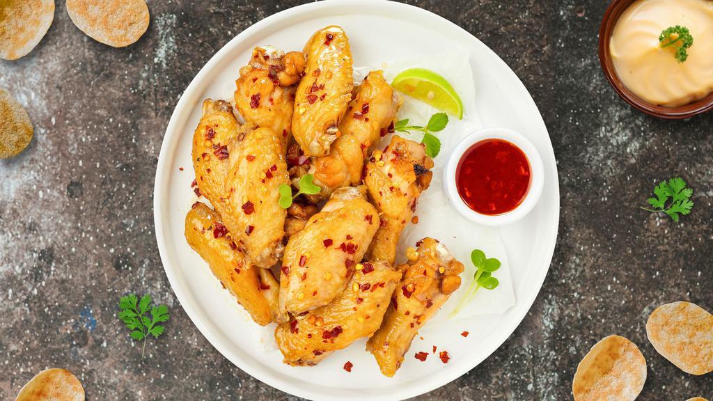 Sweet Chili Thrill Wings · Fresh chicken wings breaded, fried until golden brown, and tossed in sweet chili sauce. Served with a side of ranch or bleu cheese.
