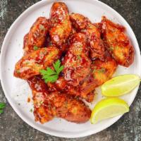 Honey Johnny Bbq Bully Wings · Fresh chicken wings breaded, fried until golden brown, and tossed in honey and barbecue sauc...