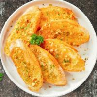 Garlic Manic Bread  · (Vegetarian) Housemade bread toasted and garnished with butter, garlic, and parsley.