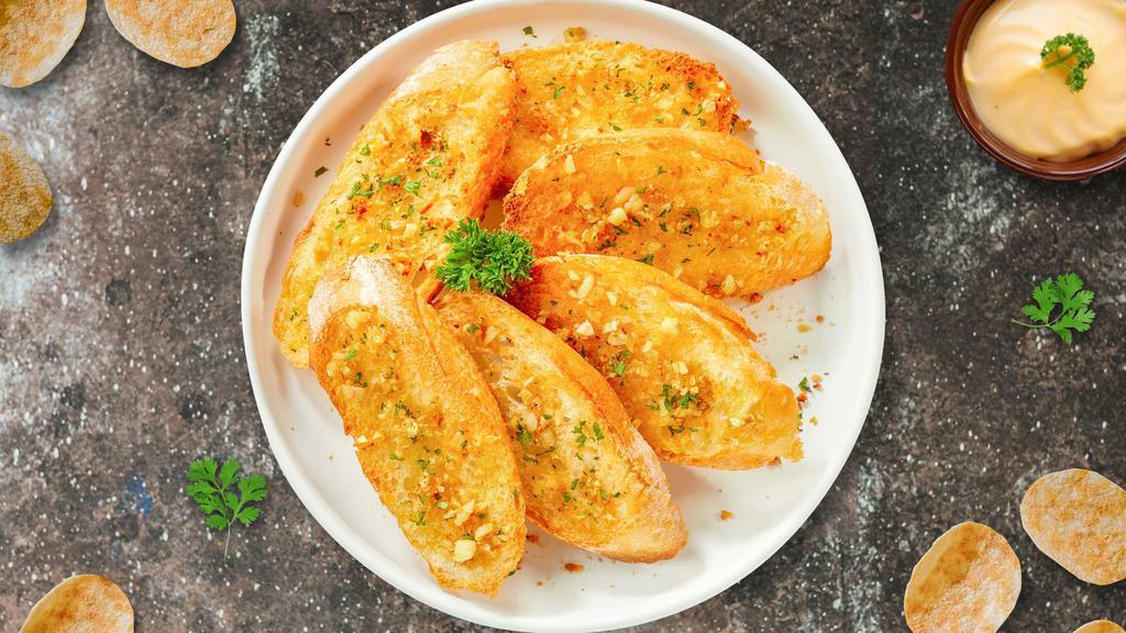Garlic Manic Bread  · (Vegetarian) Housemade bread toasted and garnished with butter, garlic, and parsley.