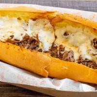 Philly Cheese Steak Sub! · sliced ribeye steak with cheese, served with choice of grilled onions, peppers and mushrooms.