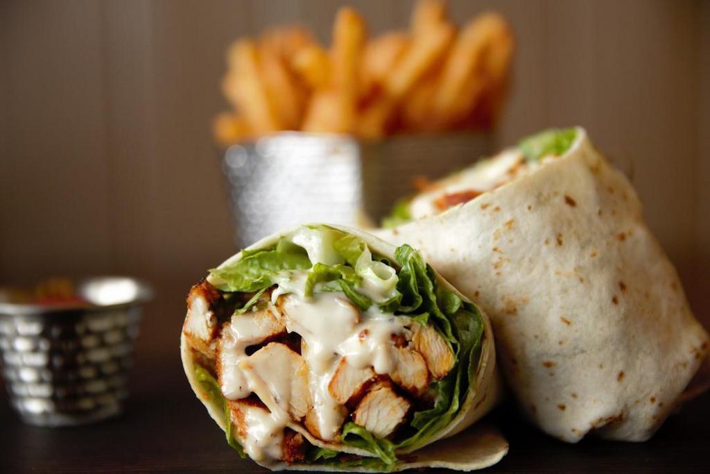 Grilled Chicken Caesar Wrap · Romaine, grilled chicken, Parmesan and Caesar dressing. Choice of white or wheat wrap, served with fries.