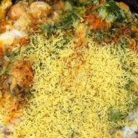 Aloo Tikki Banarasi Chaat · Potato Croquette and chickpeas drizzled with yogurt garnished with onions, cilantro, mint ch...