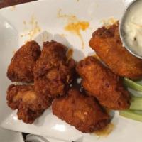 Buffalo Wings · Served with blue cheese and celery.