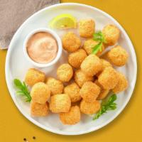 Tater Tots · (Vegetarian) Shredded Idaho potatoes formed into tots, battered, and fried until golden brown.