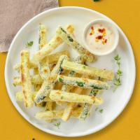 Zucchini Fries · (Vegetarian) Sliced zucchini breaded and fried until golden brown. (10 pieces)