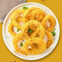 Onion Rings · (Vegetarian) Shredded Idaho potatoes formed into tots, battered, and fried until golden brown.