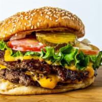 Double Cheeseburger · 2x 4 oz premium beef patties, American cheese lettuce, onions, tomatoes, house sauce and pic...
