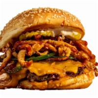 The Bbq · Featuring melted sharp cheddar, smoked bacon, frizzled onions, jalapenos, pickles and bbq sa...
