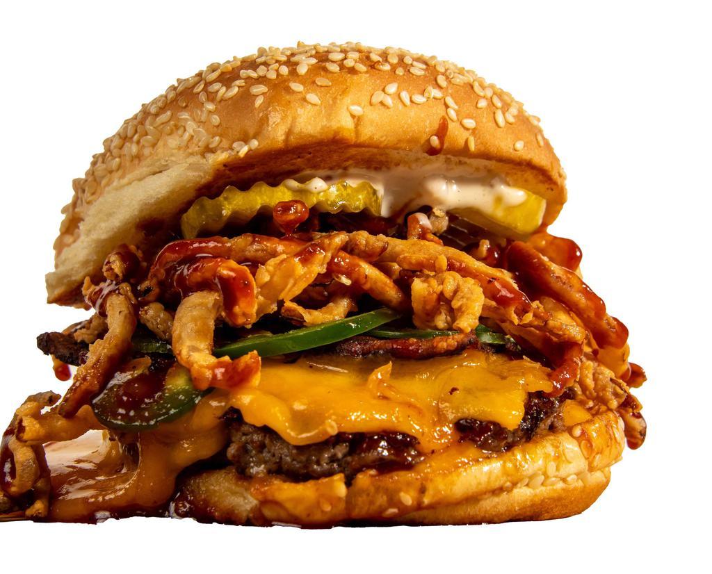 The Bbq · Melted sharp Cheddar, smoked bacon, frizzled onions, jalapeños, pickles, house sauce and BBQ sauce.