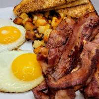 Bacon Lovers · Two eggs with six  pieces of smoked bacon, seasoned home fries, and toast.