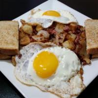 Homemade Hash & Eggs · Favorite. Slow cooked corned beef, diced onions, seasoned home fries, topped with two eggs a...