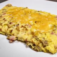 Three Little Pigs Omelet · A combination of crisp bacon, diced ham, and crumbled sausage, with cheddar jack cheese.