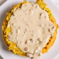 Lumberjack Waffle · Hash browns mixed with diced bacon, sausage, and scrambled eggs, topped with sausage gravy.