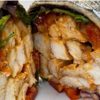 Buffalo Chicken Shack Wrap · Grilled Buffalo chicken, mixed greens, tomato and crumbled blue cheese with blue cheese dres...