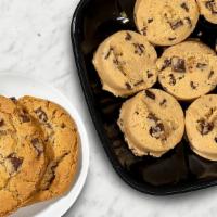Take & Bake Jumbo Chocolate Chip Cookie Kit · Bake our JUMBO Chocolate Chip Cookies at home!  Serves 6-8