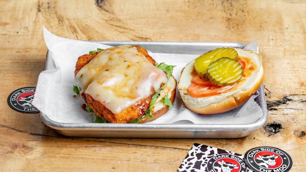 Hot Chix · Spicy chicken sandwich! Breaded chicken filet, melted pepperjack cheese, Cajun mayo, lettuce, tomato, pickles, peri-peri hot sauce and hot honey on a toasted brioche roll