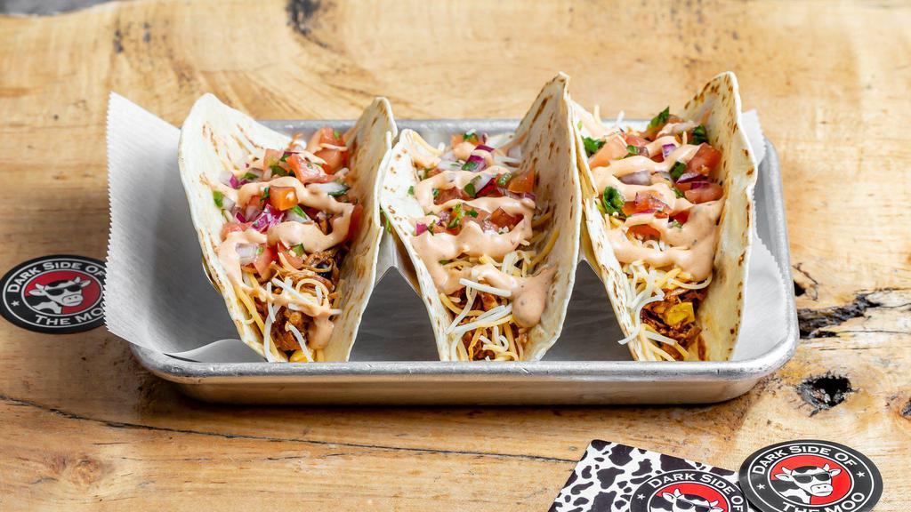 3 Pulled Pork Tacos · Soft shell flour tortilla with pico de gallo, roasted corn, black beans, cheddar, Monterey Jack and chipotle ranch.