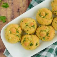 Garlic Knots · Warm fresh baked dough infused with garlic, parsley and parmesan cheese.