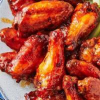 Wings · 8 juicy deep-fried chicken wings tossed in your choice of sauce. Comes with a bleu cheese sa...