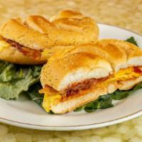 2 Eggs With Meat And Cheese · Bagel and Deli Creations of Bethpage favorite: Choice of bacon, turkey or ham with cheese.