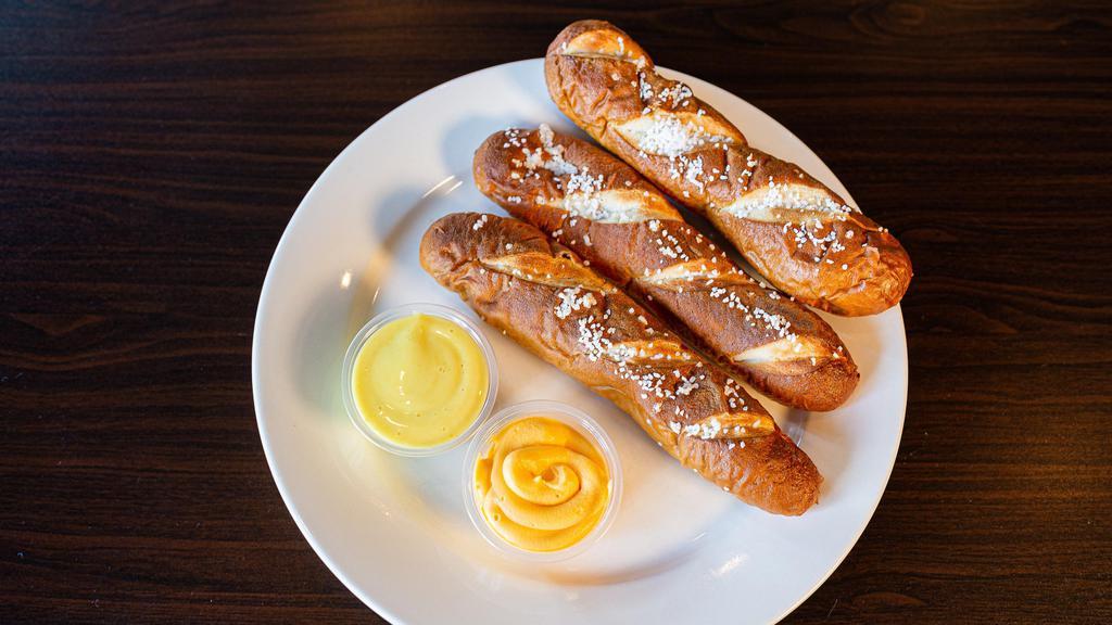 Bavarian Pretzel Sticks · Served with nacho cheese & honey mustard.