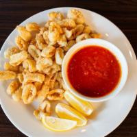 Crispy Calamari · Fried squid served with marinara sauce.