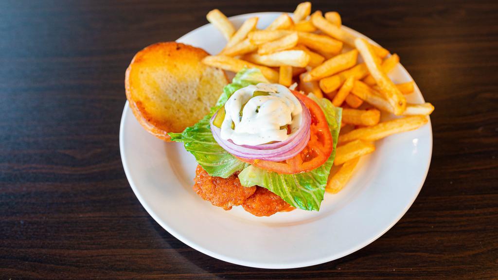 Buffalo Chicken · Buffalo chicken with tomatoes, red onions, pickles, buttermilk ranch dressing on a brioche bun.