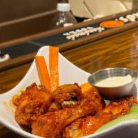 Del Sur Wings · 6 or 10 wings served with blue cheese, celery and carrots sticks.