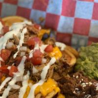 Del Sur Nachos · Tortilla chips, black beans, cheese, tomato, onions, jalapeños, guacamole and your choice of...
