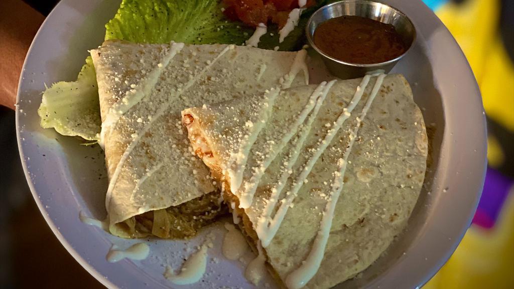 Quesadilla · Served on a flour tortilla filled with mixed cheeses, topped with sour cream &  cotija cheese. add your choice of meat.