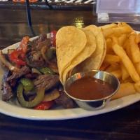 Del Sur Fajitas · Sautéed onions and bell peppers served with rice, tortillas and colombian aji sauce. Your ch...
