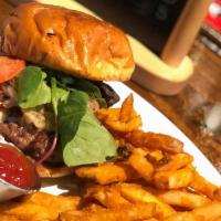 Del Sur Burger · On a brioche bun, bacon & beef patty, caramelized onions, tomato, mixed greens, mixed cheese...