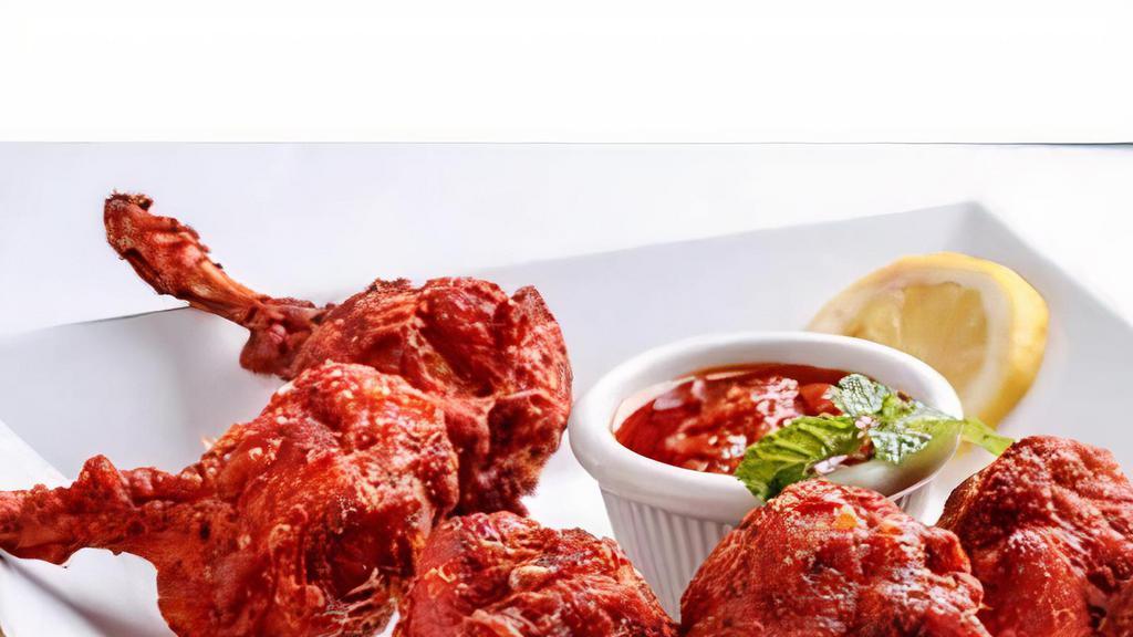 Chicken Lollipop (4) · Chicken lollipop is an deep-fried popular. Indian Chinese, essentially a frenched chicken winglet.