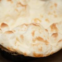 Plain Naan · Unleavened bread freshly baked in a clay oven.