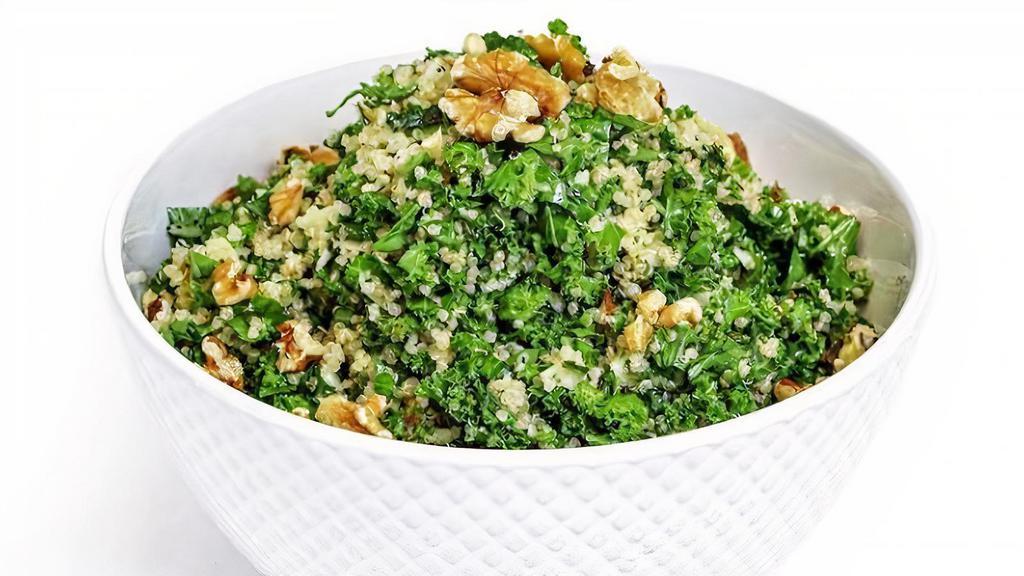 Daouda'S Kale Quinoa Salad · Vegetarian, vegan, gluten free. Organic. Kale salad served with quinoa, scallions, evergreen green apple, walnuts, cucumber, mint, cilantro, and lemon vinegar dressing.