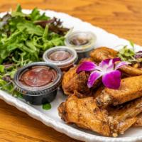 Adama'S Wings · Gluten free, medium. Seasoned baked and fried chicken wings served with mixed green salad, A...